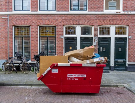 Street-level recycling bins and business frontage in Fitzrovia