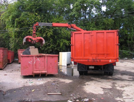 Front view of a commercial waste collection vehicle operating in Fitzrovia streets